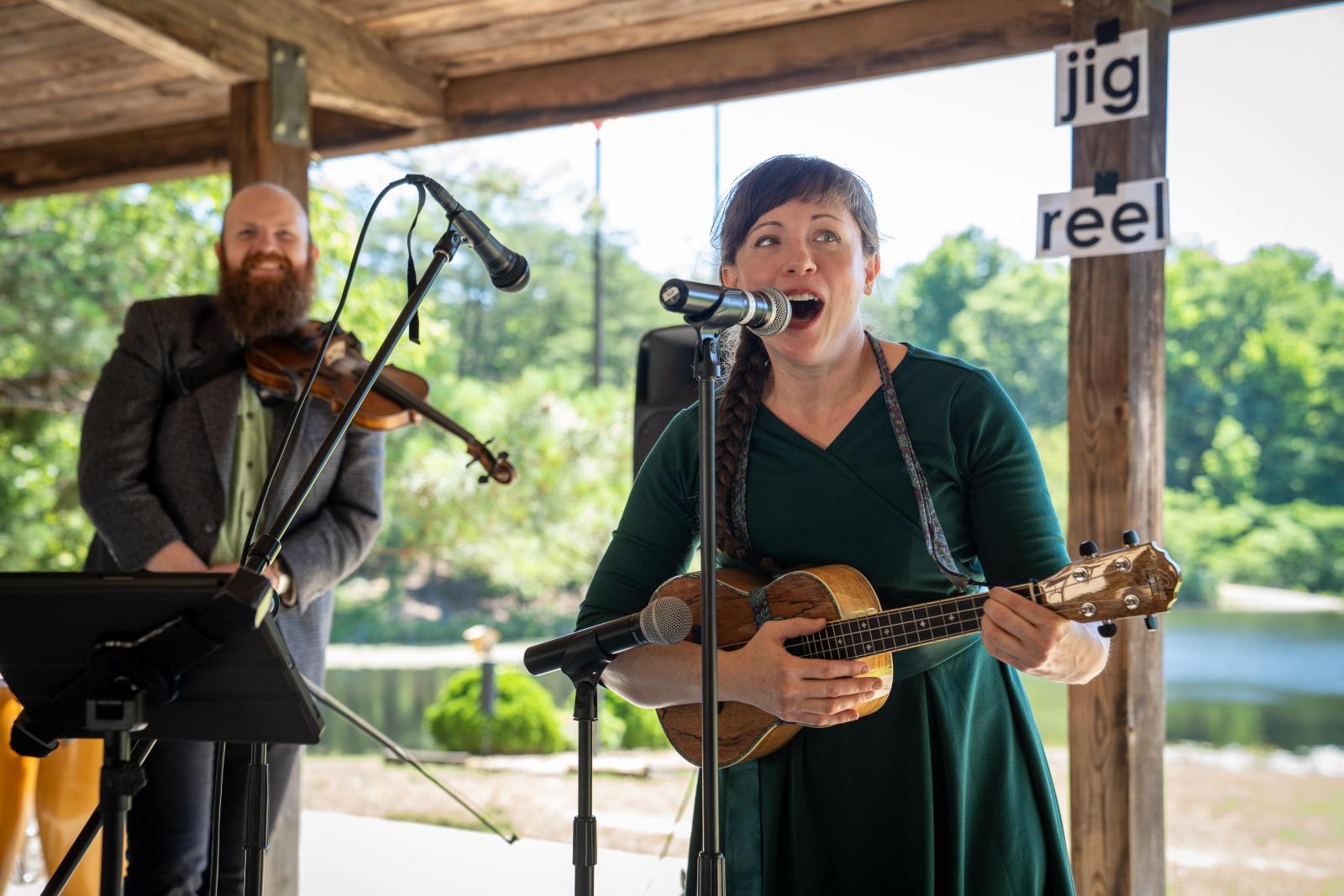 Teaching artist group performing in outdoor pavilion.