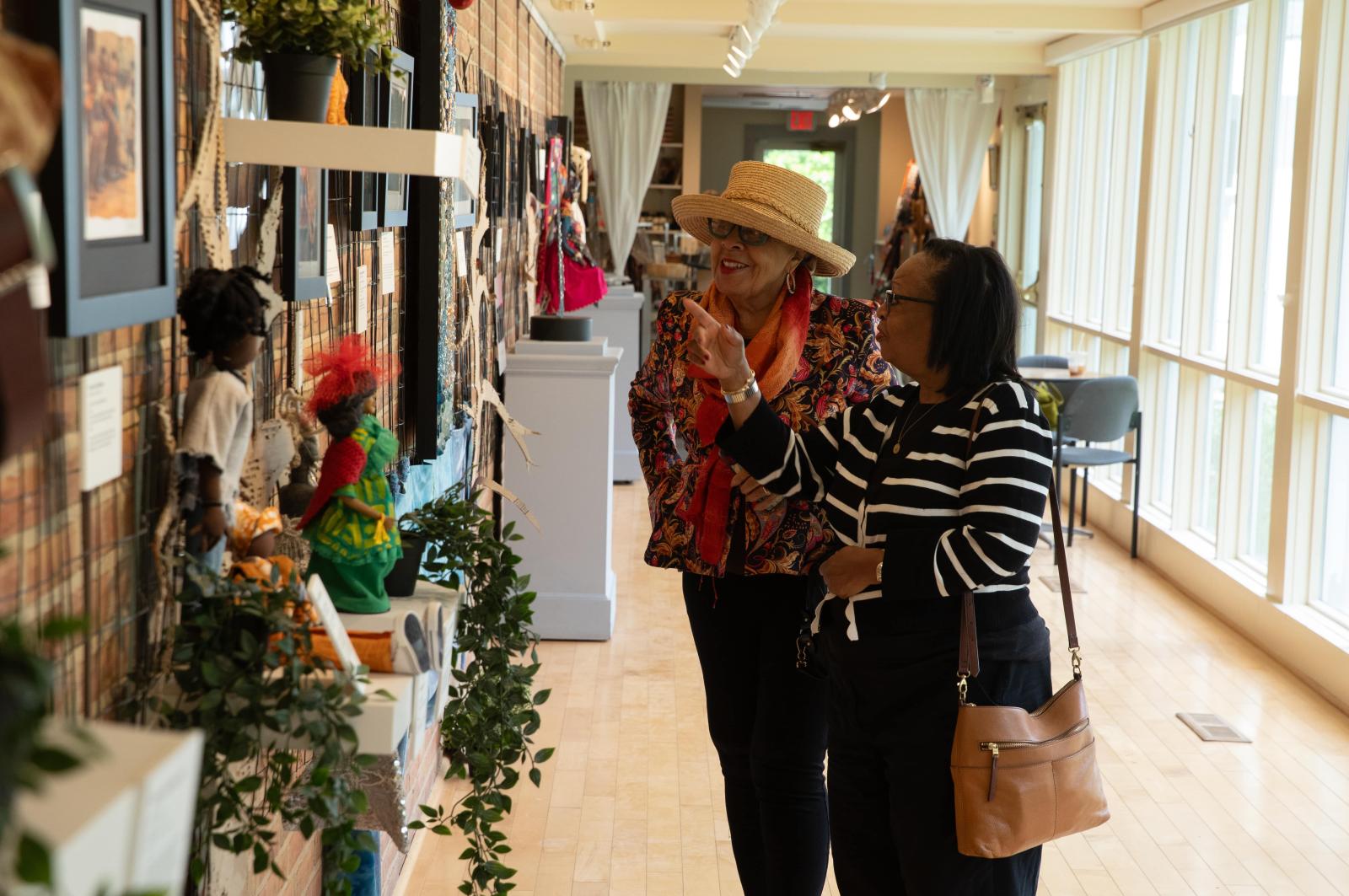 Attendees viewing an exhibition at Sandy Spring Museum in Montgomery County.